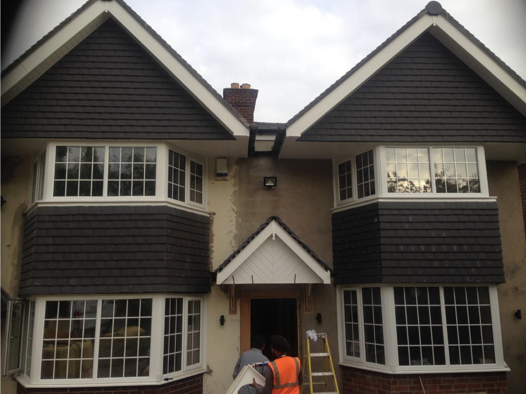 New build house exterior with West Top Builders team